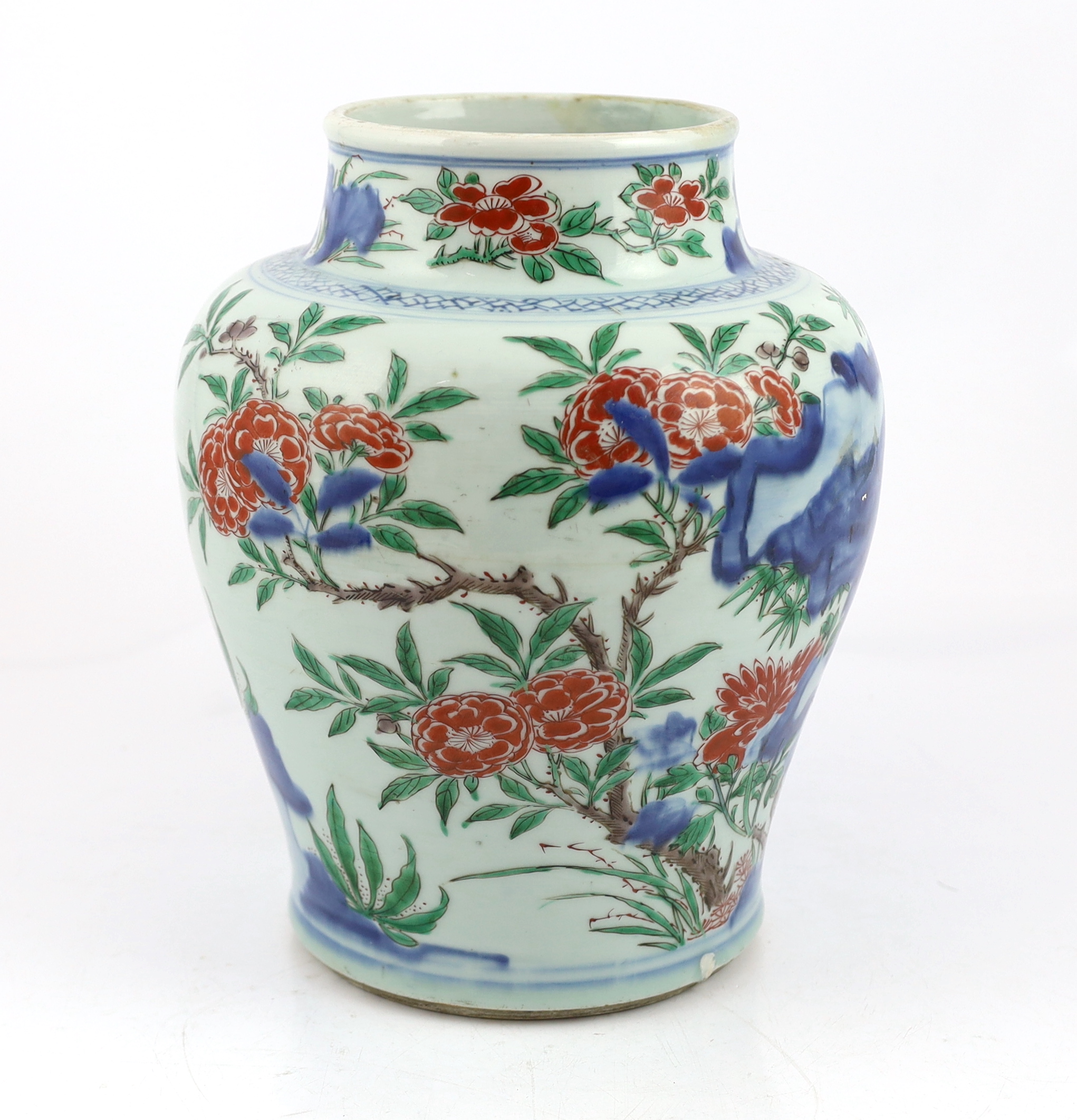 A Chinese wucai ‘rocks and blossom’ vase, Transitional, Shunzhi period, cracked and restoration to neck